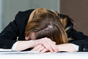 Woman sleeping at desk