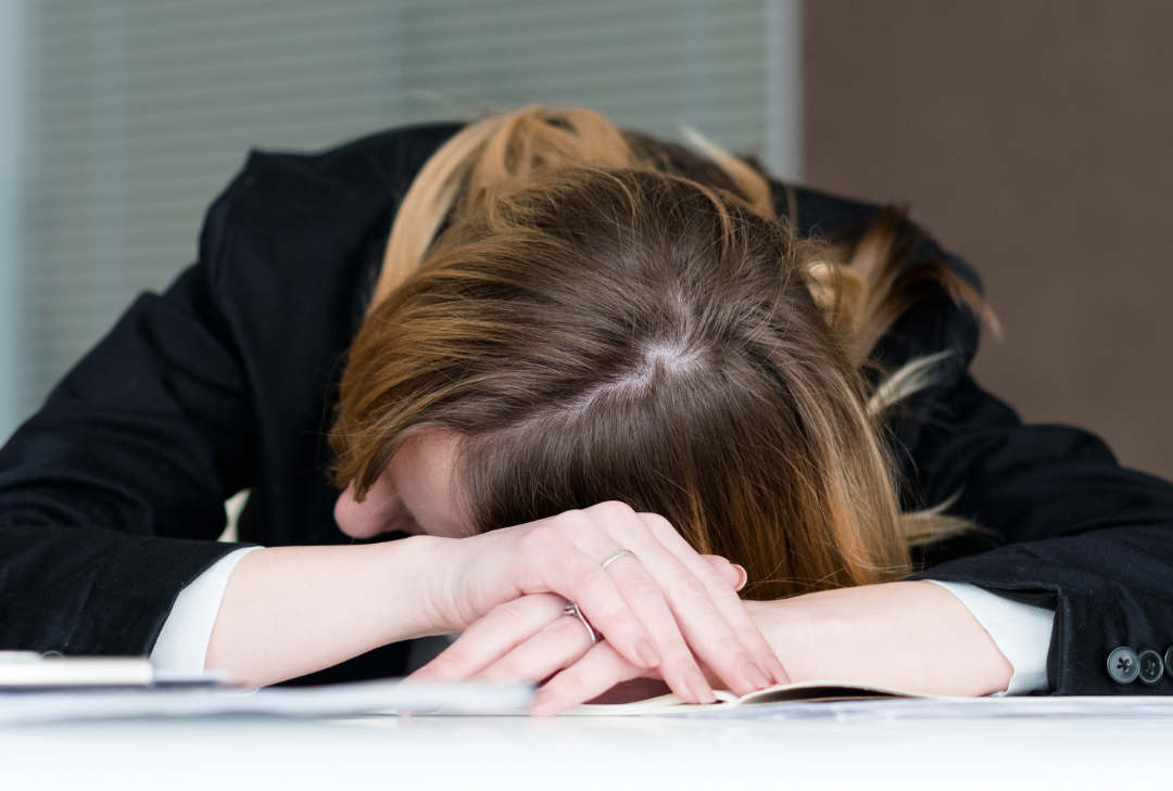Blog Header Sleep Deprivation and Health & Safety Woman sleeping at desk - is sleep deprivation a Health & Safety Risk?